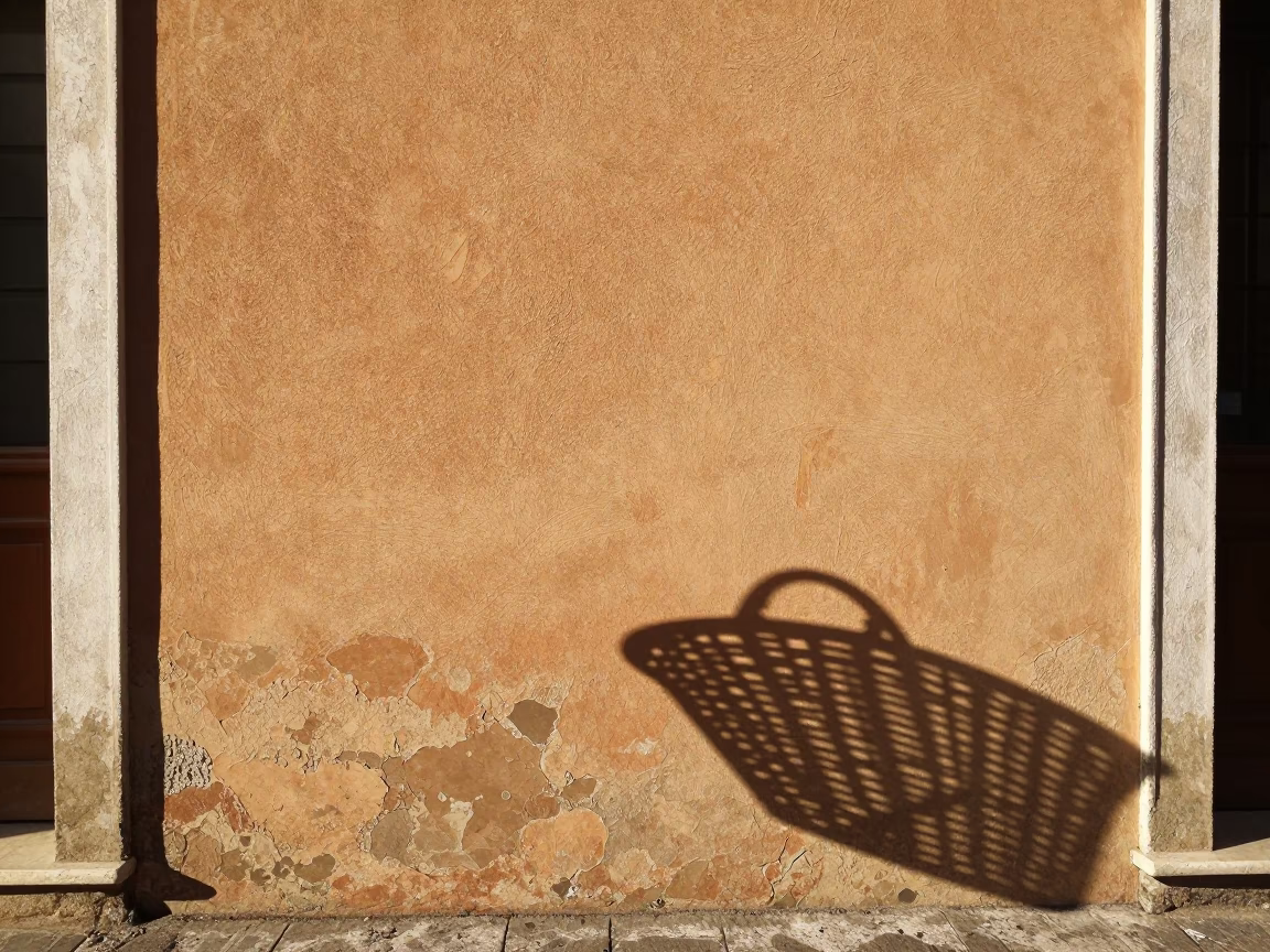 Late Morning Sunlight on Bologna Plaster Wall with Wicker Shadow and Latch Detail in in Bologna, Italy