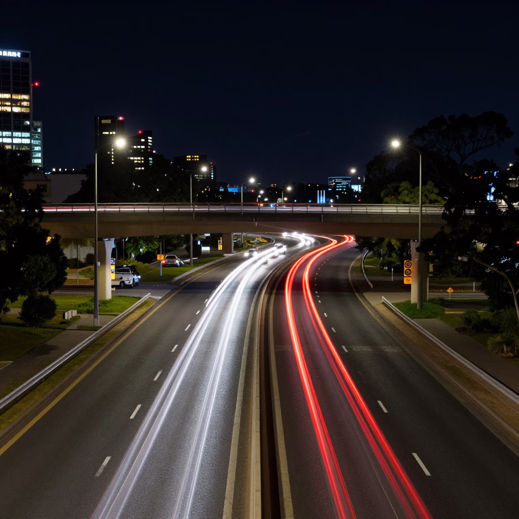 Late Night Adelaide Overpass Interchange Lane Split Lit by Red Taillight Streaks in in Adelaide, South Australia, Australia