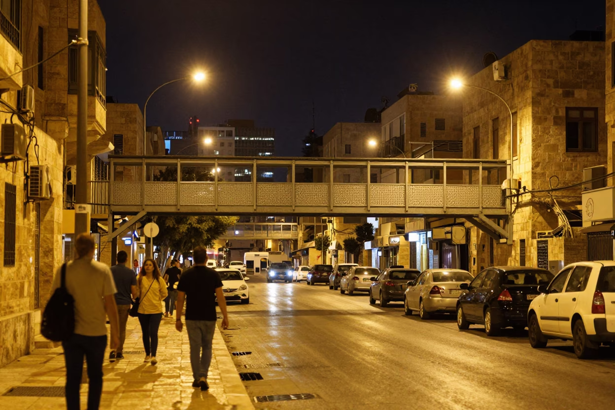 Late Night Amman Street Scene with Pedestrian Overpass and Urban Life in in Amman, Jordan