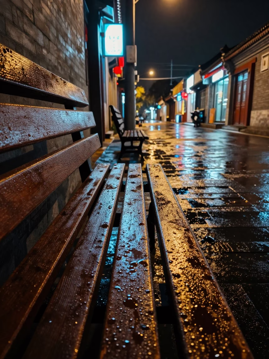 Late Night Beijing Street Scene with Condensation on Bench and Urban Reflections in in Beijing, China