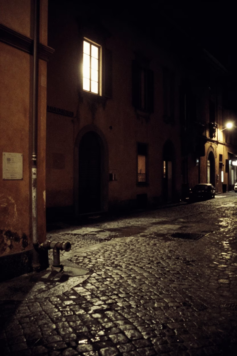 Late Night Bologna Street Scene with Window Light and Steaming District Heating Pipes in in Bologna, Italy