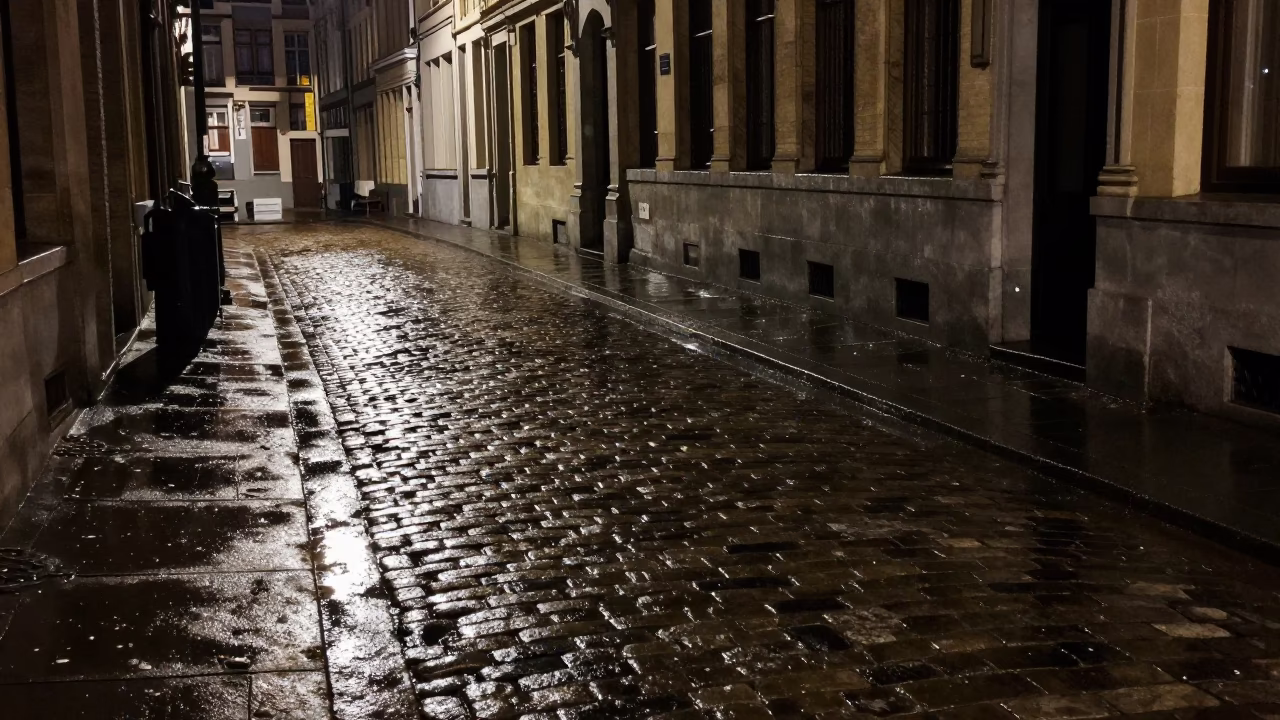 Late Night Brussels Street Scene with Wet Cobblestones and Substation Puddles in in Brussels, Belgium