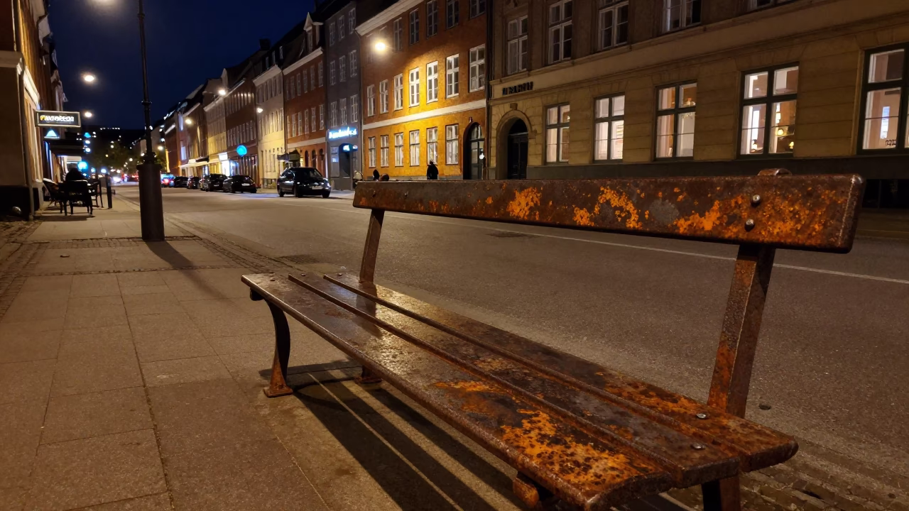 Late Night Copenhagen Street Scene with Rusty Bench and Urban Reflections in in Copenhagen, Denmark