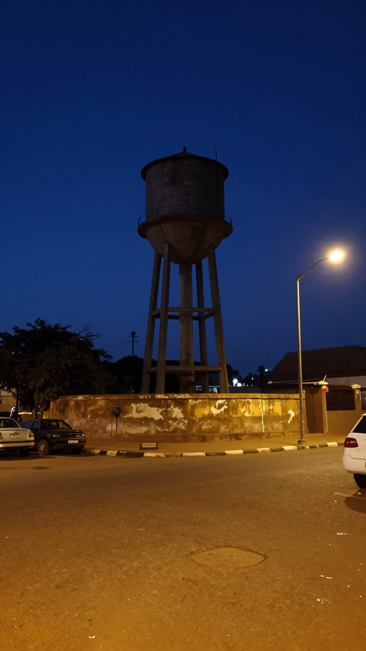Late Night Dakar Street Scene with Water Tower and Urban Life in in Dakar, Senegal