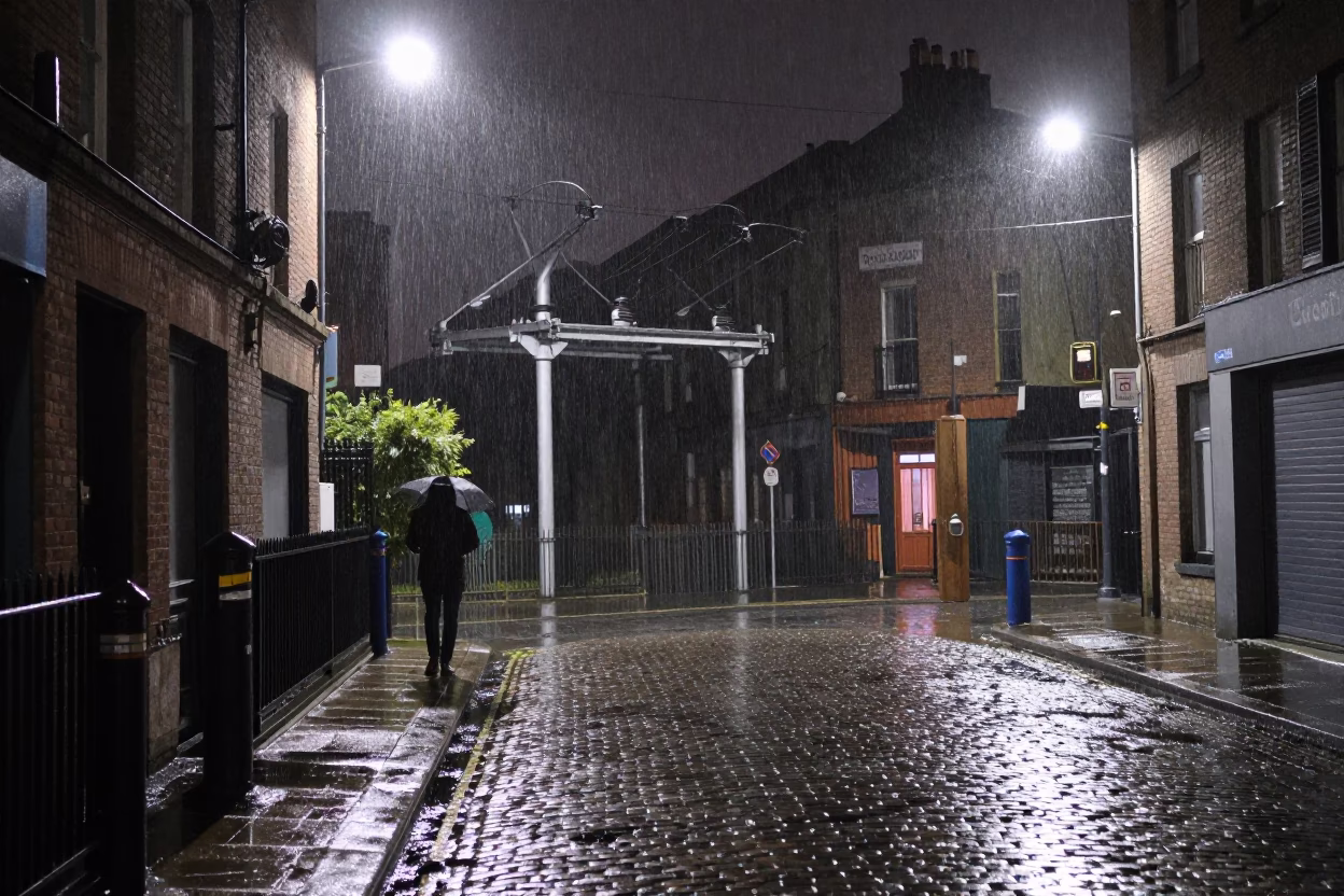 Late Night Dublin Street Scene with Substation Insulators and Rain Under Floodlights in in Dublin, Ireland