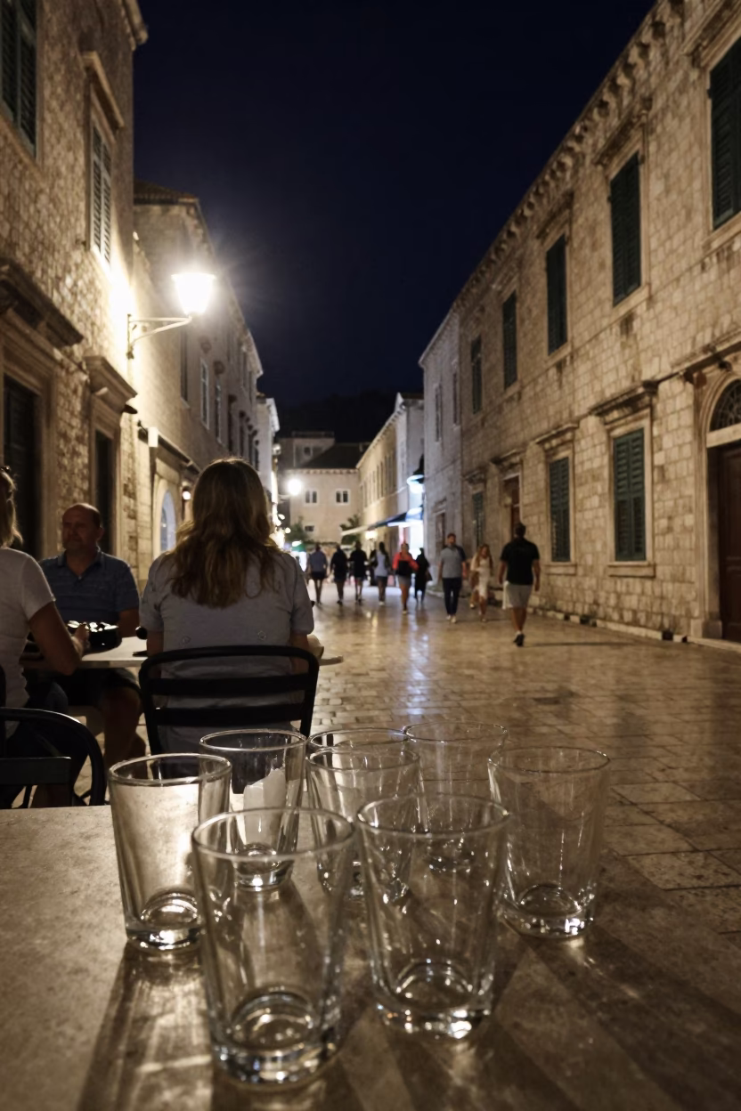 Late Night Dubrovnik Street Scene with Glass Tumblers and Urban Nightlife in in Dubrovnik, Croatia