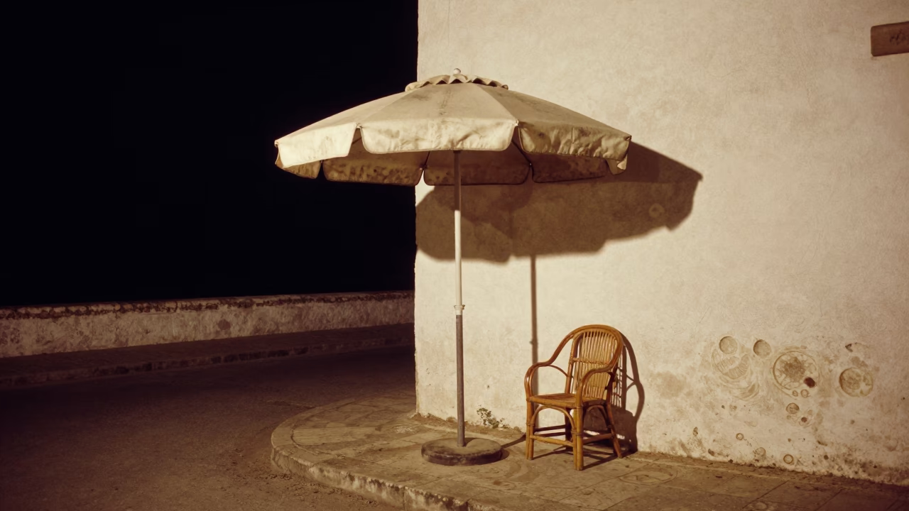 Late Night Essaouira Morocco Coastal Street Scene with Umbrella Stand and Rattan Chair in in Essaouira, Morocco