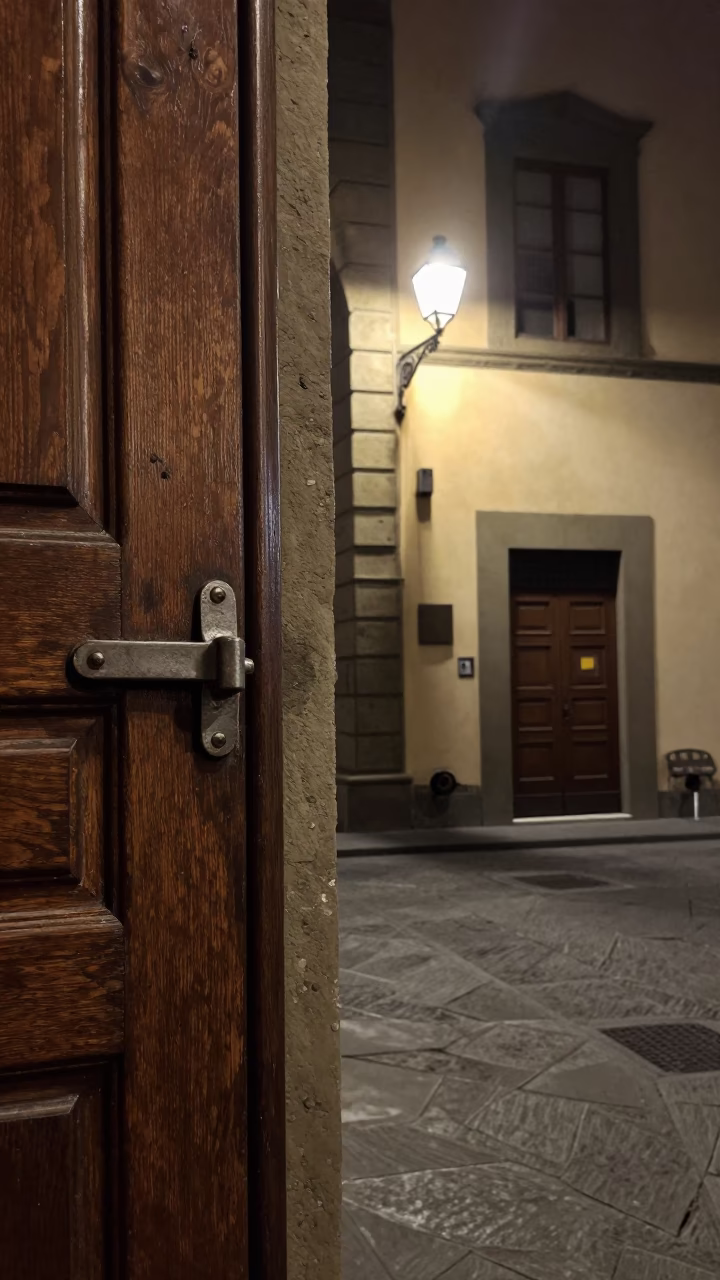 Late Night Florence Street Scene with Deadbolt Lock and Fingerprints on Latch in in Florence, Italy
