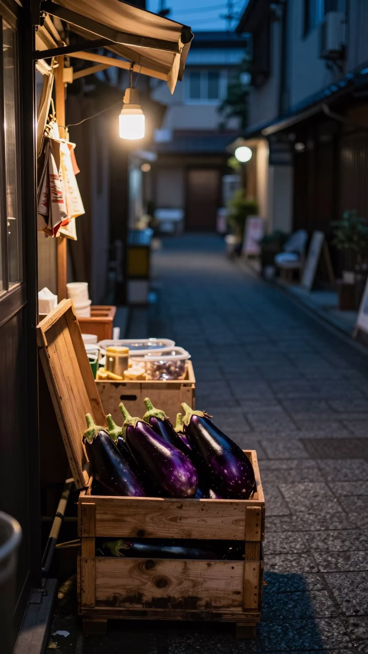 Late Night Fukuoka Street Scene with Crate and Eggplants in Traditional Alley in in Fukuoka, Japan
