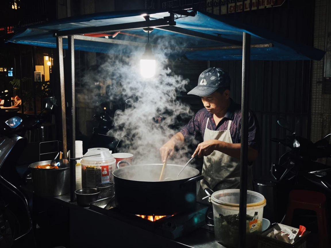 Late Night Hanoi Street Food Stall with Cooking Pot and Slippers in in Hanoi, Vietnam