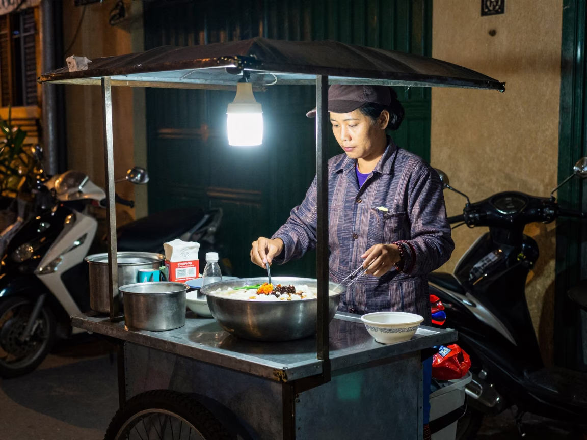 Late Night Hanoi Street Food Vendor Serving Taho Dessert with Vintage Bicycle in in Hanoi, Vietnam