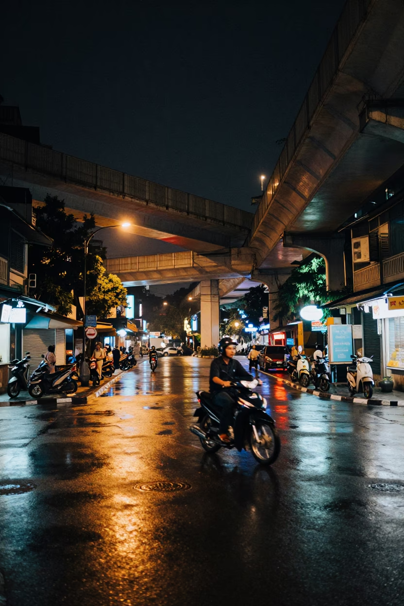Late Night Hanoi Street Scene with Overpass Interchange Glowing After Rain in in Hanoi, Vietnam