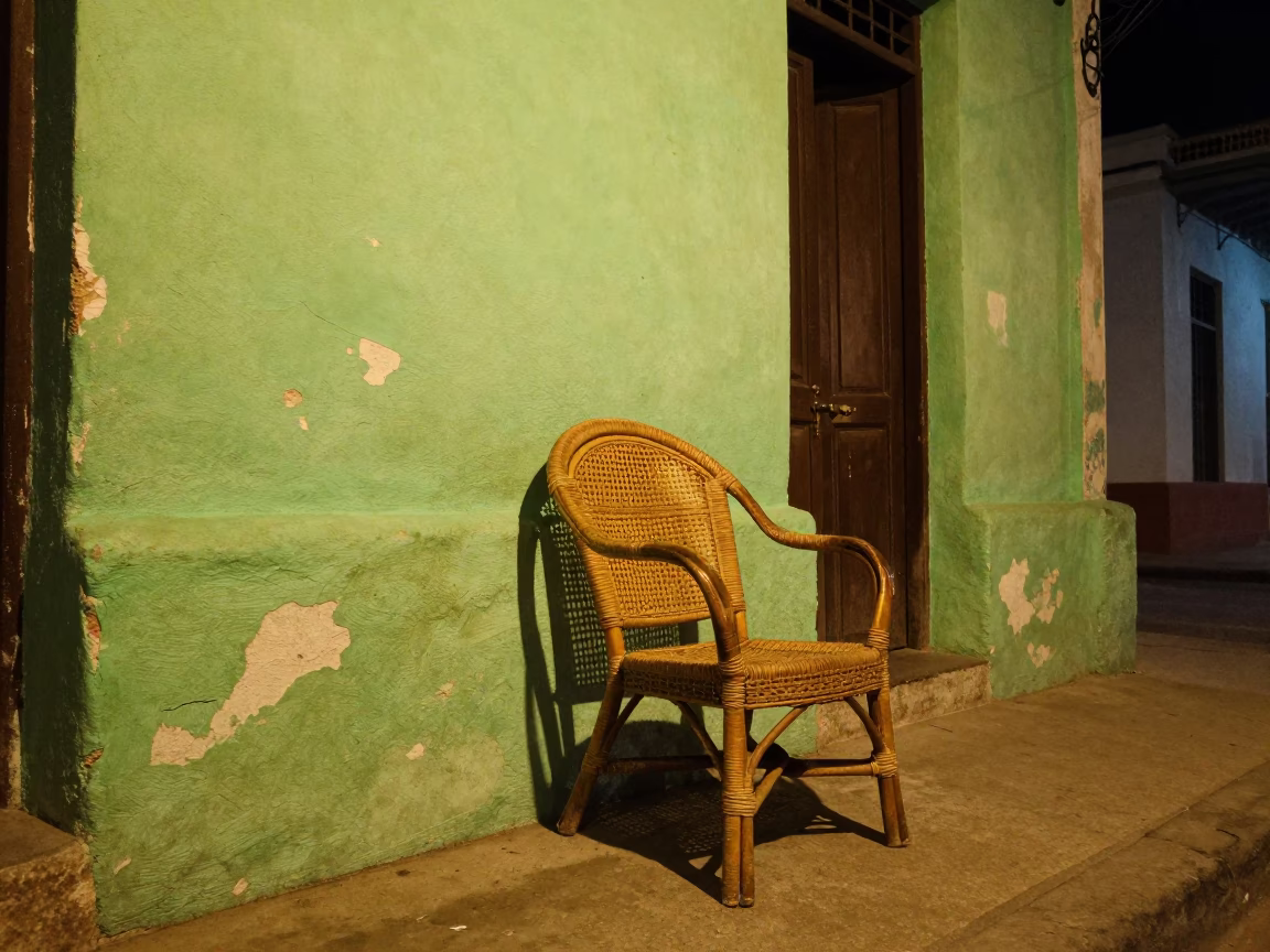 Late Night Havana Street Scene with Rattan Chair and Teapot on Balcony in in Havana, Cuba