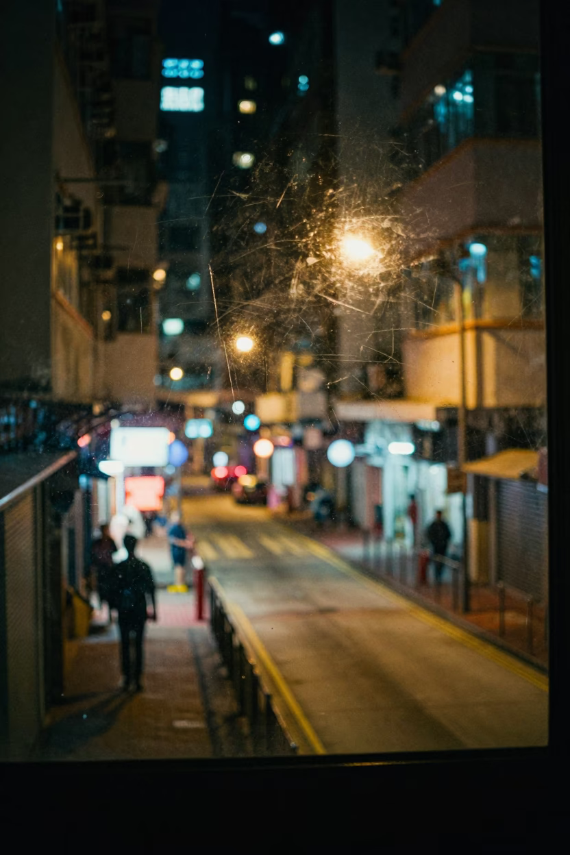 Late Night Hong Kong Street Scene with Scratched Window Glass and Watering Bottle in in Hong Kong, Hong Kong