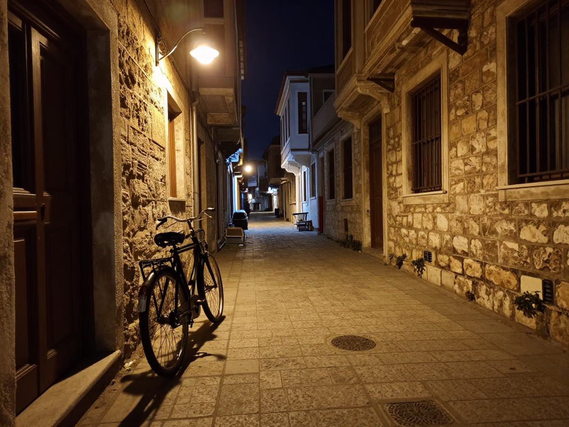 Late Night Izmir Street Scene with Vintage Bicycle and Stone Architecture in in Izmir, Turkey