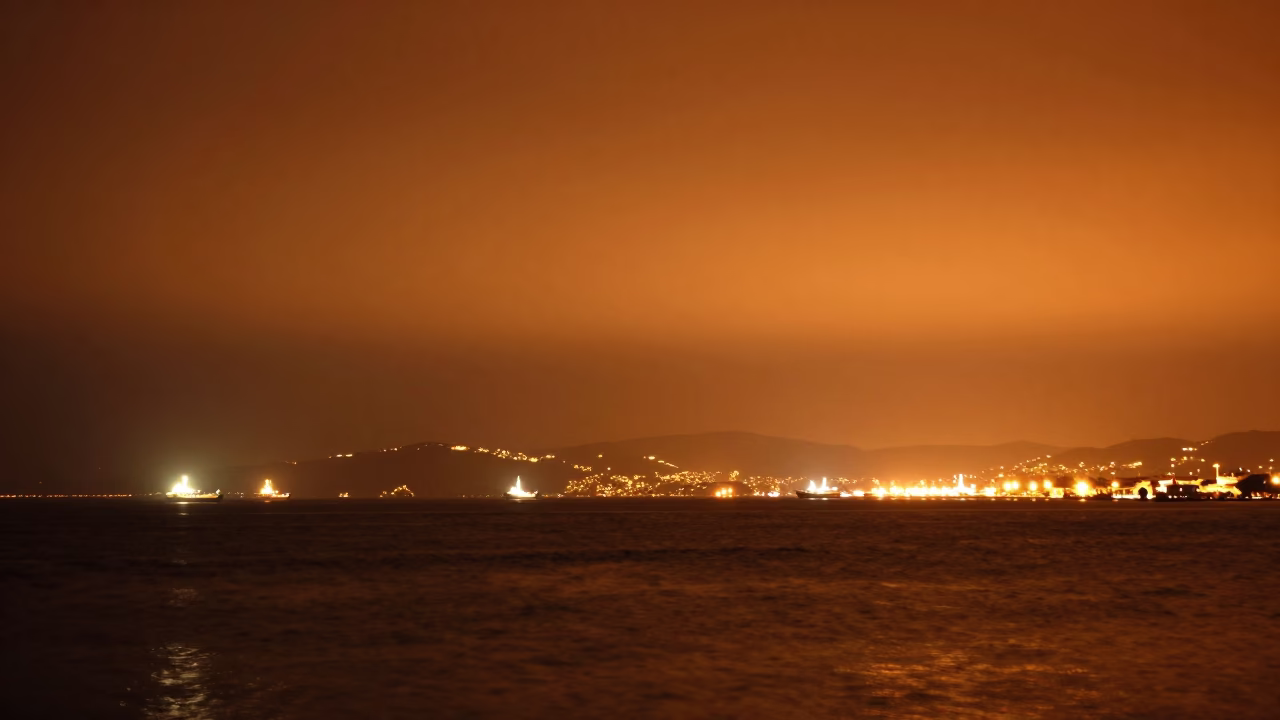 Late Night Izmir Turkey Harbor Sodium Light and Distant Horizon in in Izmir, Turkey