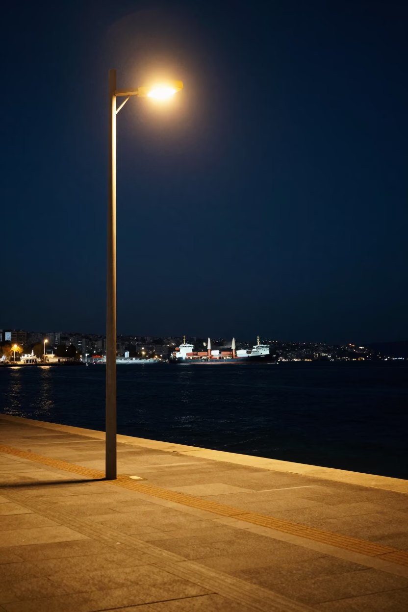 Late Night Izmir Turkey Harbor View with Cargo Ship Horizon and Street Lamp in in Izmir, Turkey