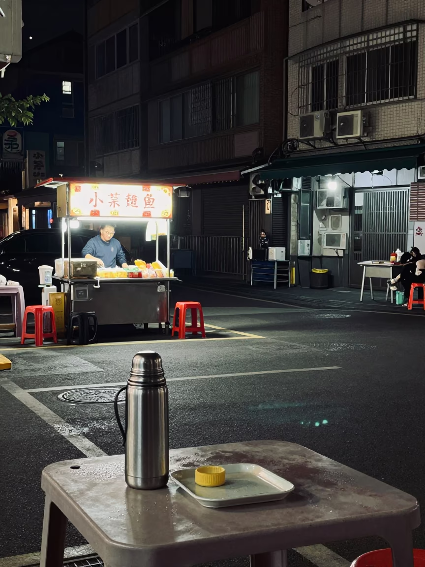 Late Night Kaohsiung Street Scene with Condensation Rings and Thermos Near Modern Transit Hub in in Kaohsiung, Taiwan