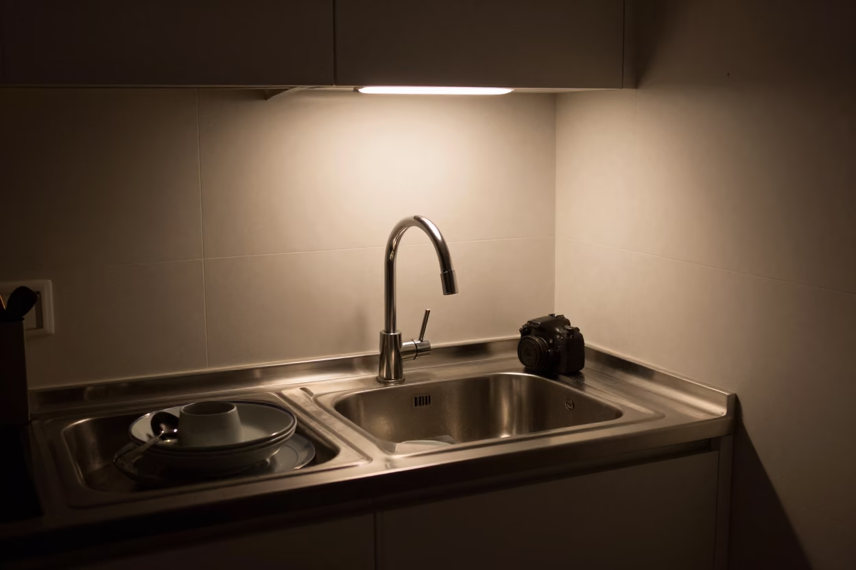 Late Night Kitchen Interior in Bilbao Apartment with Sink and Wooden Ladder in in Bilbao, Spain