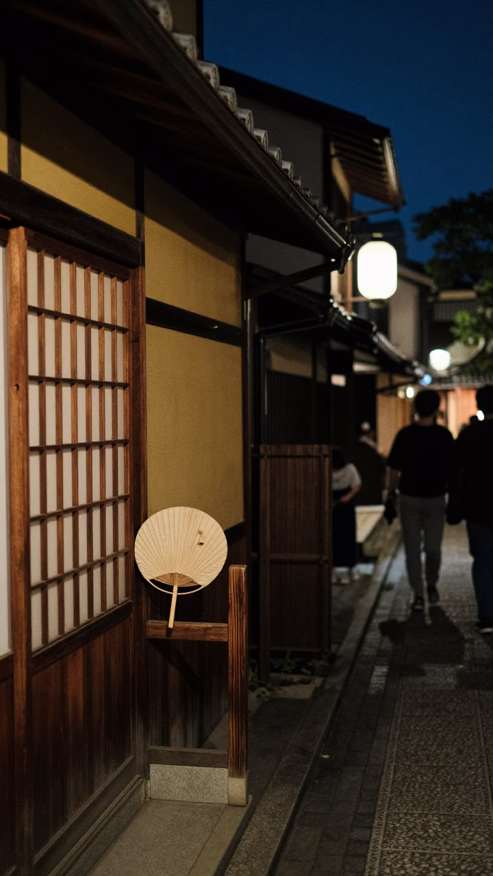 Late Night Kyoto Street Scene with Paper Fan and Lanterns Under Deep Night Sky in in Kyoto, Japan