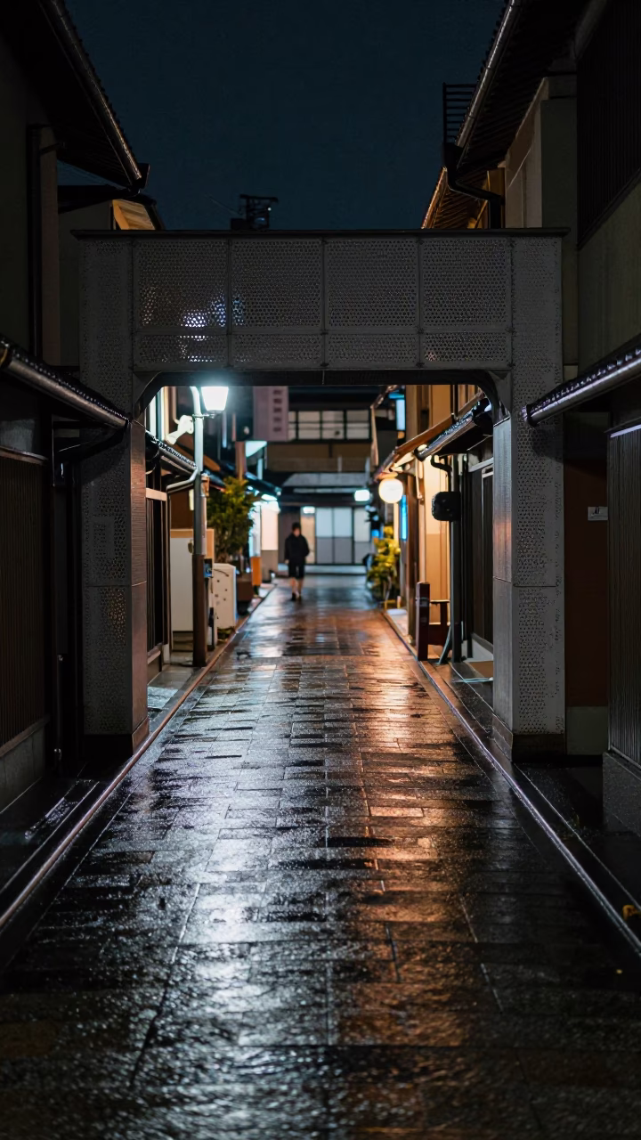 Late Night Kyoto Street Scene with Wet Footsteps and Urban Decay Details in in Kyoto, Japan