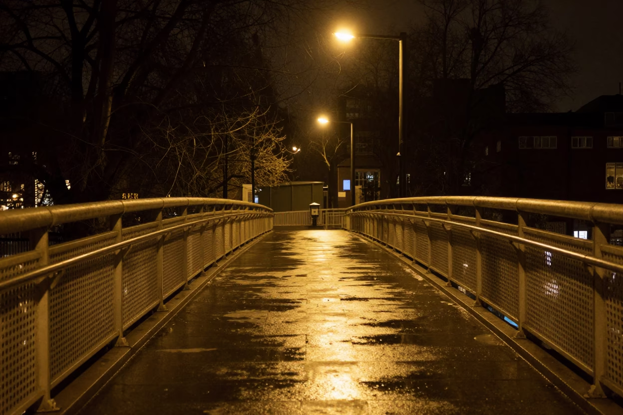 Late Night London Pedestrian Overpass Perforated Metal and Wet Footsteps in in London, United Kingdom