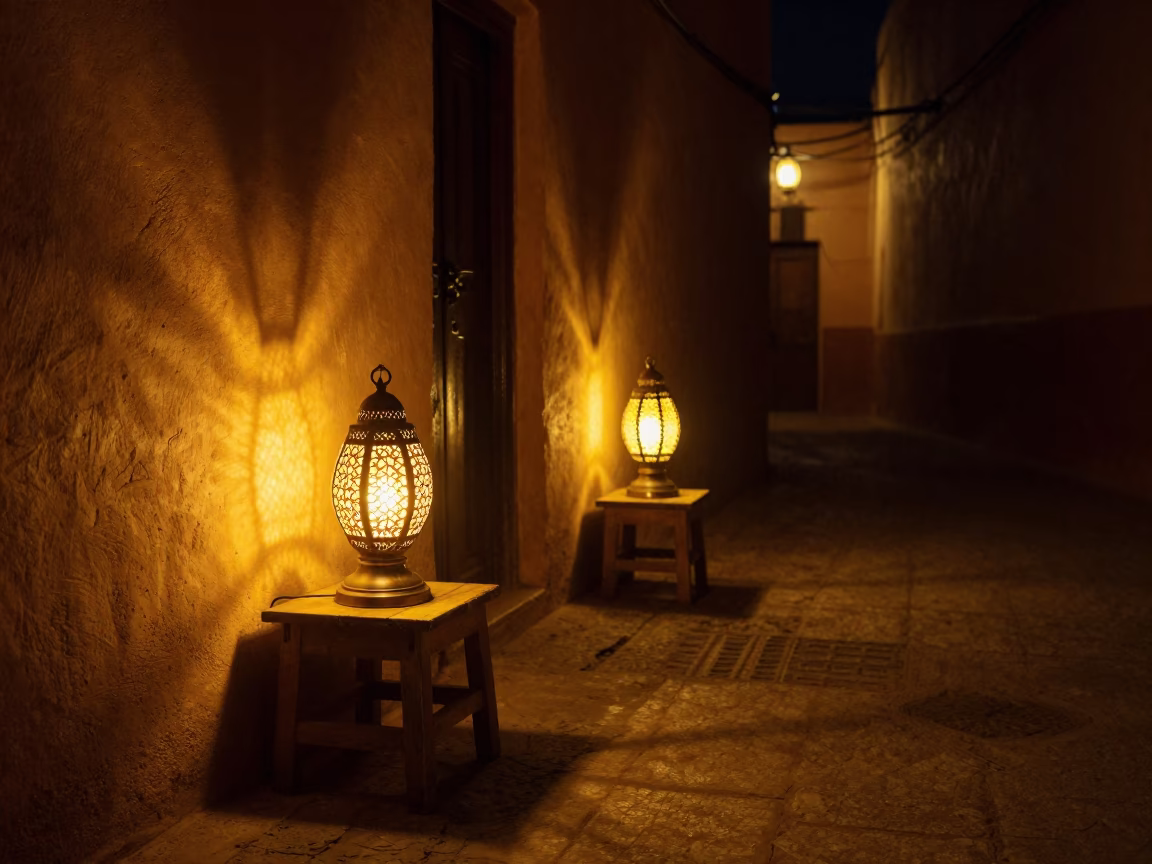 Late Night Marrakech Medina Alleyway with Flickering Table Lamps and Weathered Stool in in Marrakech, Morocco