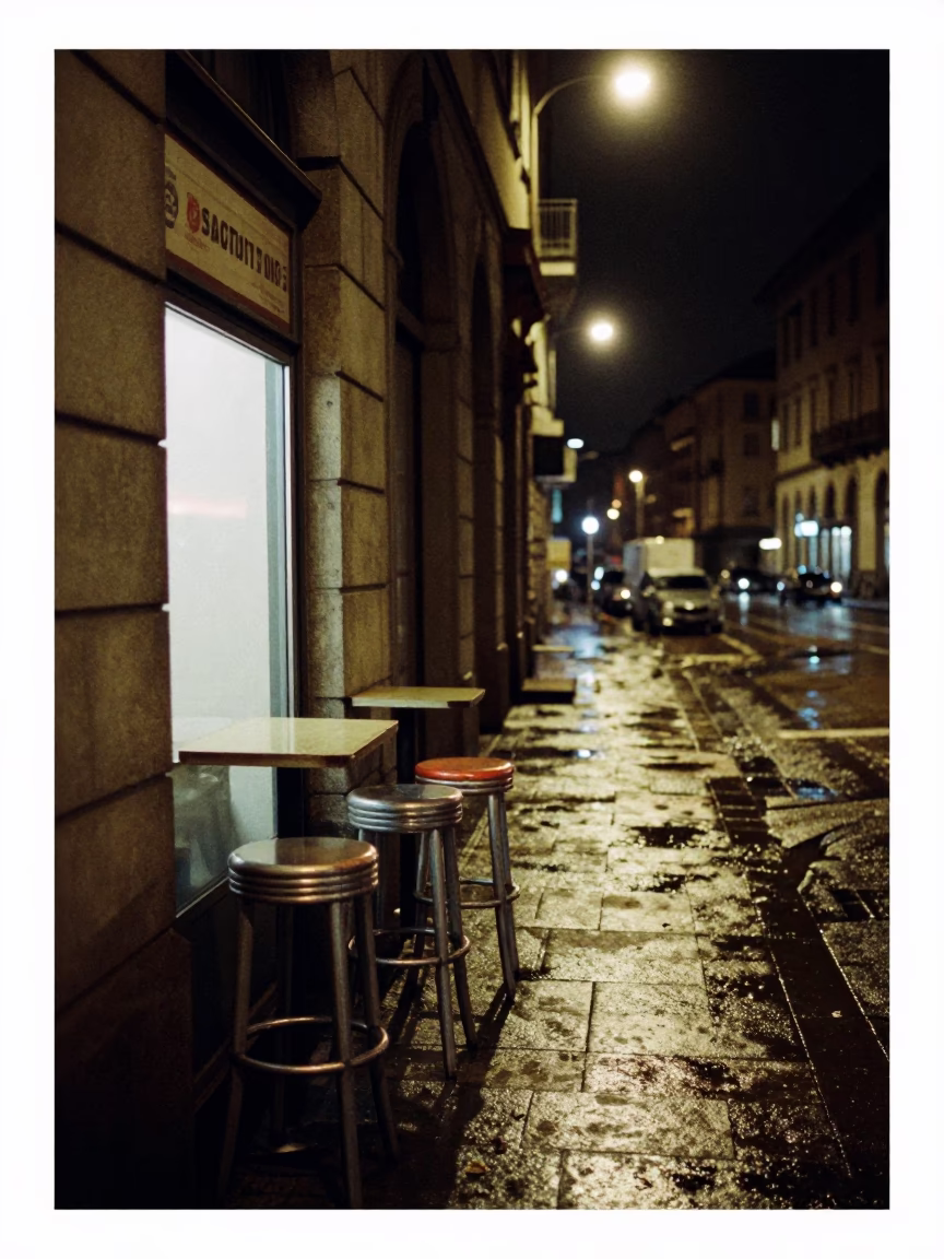 Late Night Milan Street Scene with Bar Stools and Urban Architecture in in Milan, Italy