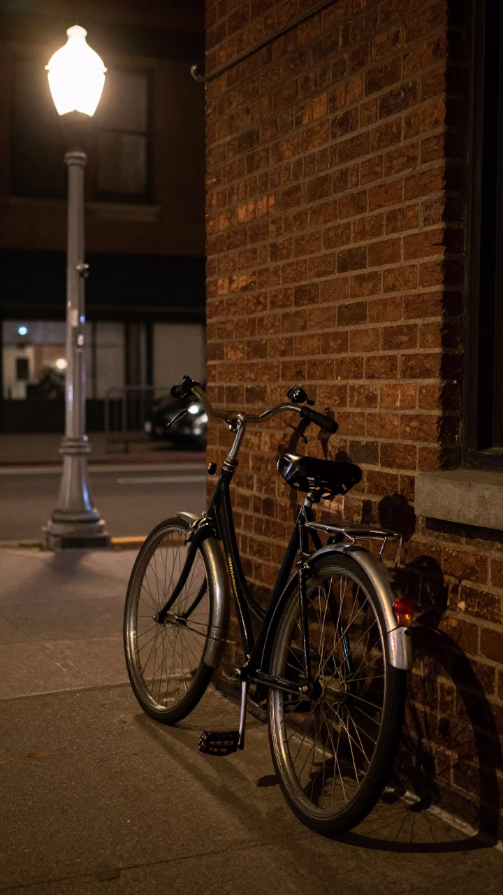 Late Night New York Street Scene with Vintage Bicycle and Stone Bench in in New York, New York, United States