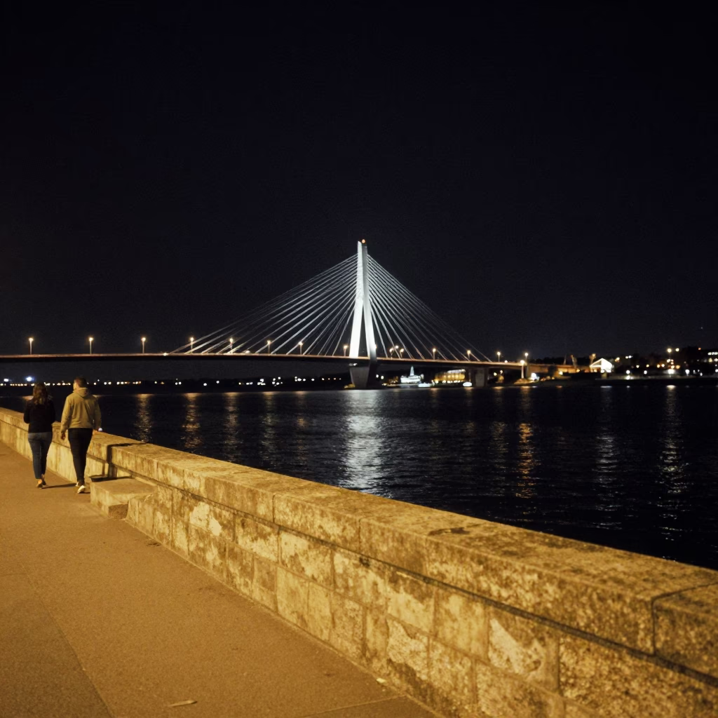 Late Night Nice France Street Scene with Illuminated Bridge and Brass Accents in in Nice, France