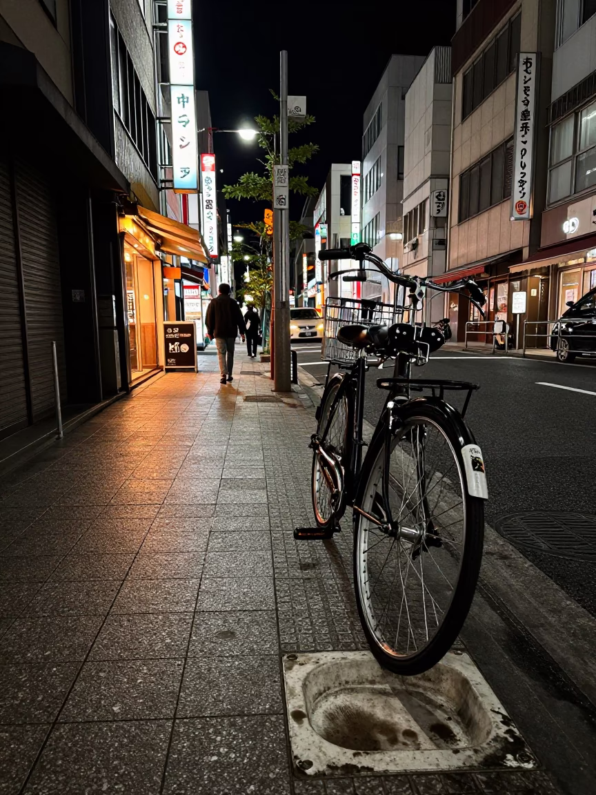 Late Night Osaka Street Scene with Bicycle and Urban Architecture in in Osaka, Japan