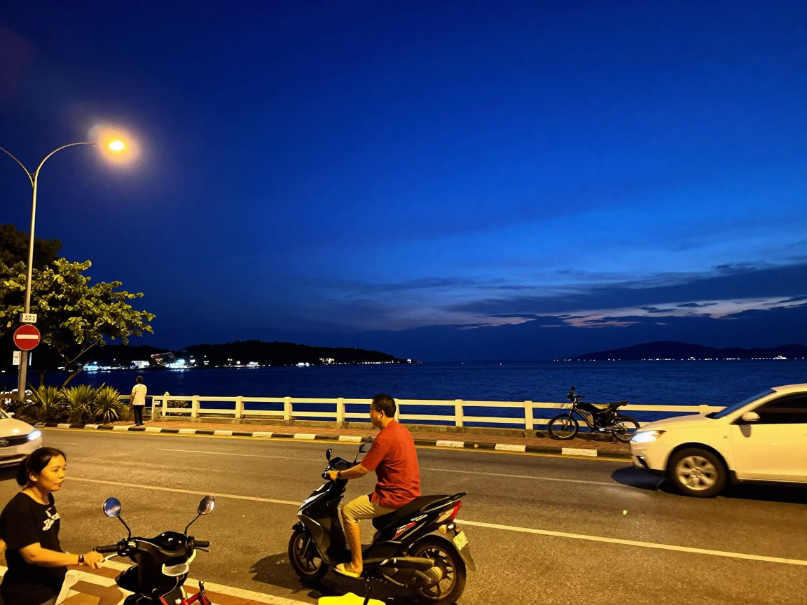 Late Night Phuket Street Scene with Blue Hour Sky and Harbor Breakwater in in Phuket, Thailand