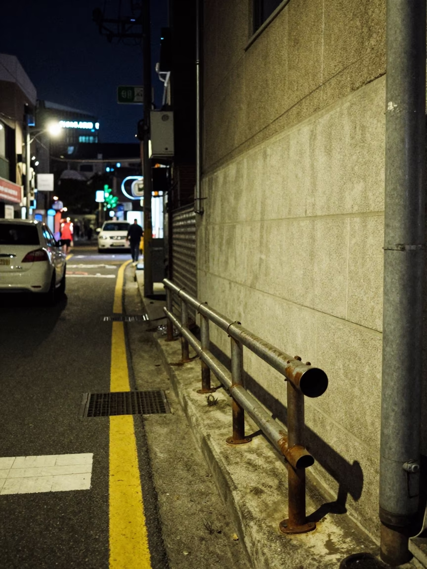 Late Night Seoul Street Corner with Peg Rail and Rusty Rim Detail in in Seoul, South Korea