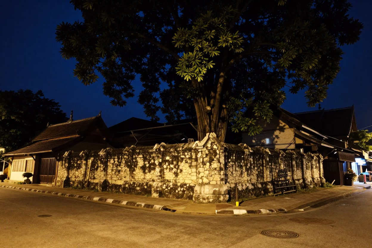Late Night Street Scene in Chiang Mai Thailand with Stone Wall and Banyan Grove in in Chiang Mai, Thailand