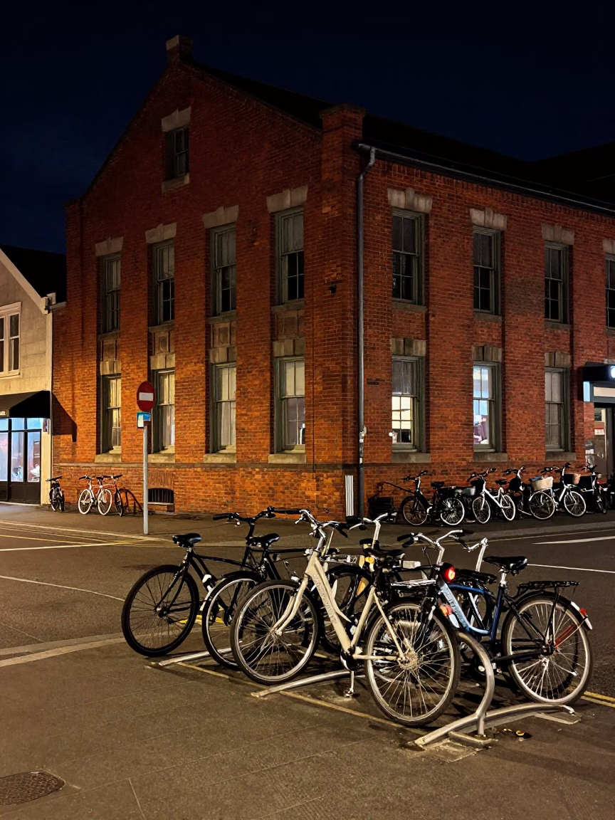 Late Night Street Scene in Christchurch New Zealand With Bicycle Rack and Umbrella Stand in in Christchurch, New Zealand