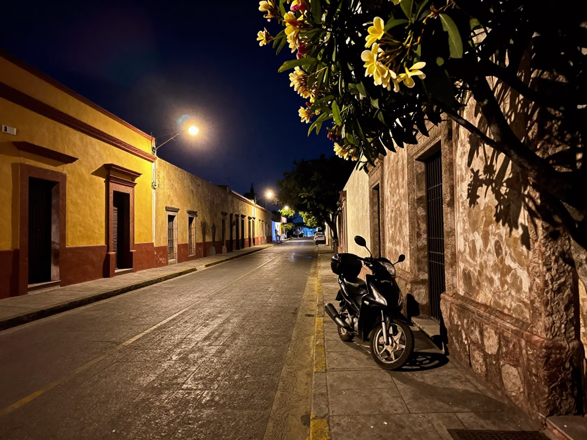 Late Night Street Scene in Guadalajara Mexico with Frangipani Bloom and Motorcycle in in Guadalajara, Mexico