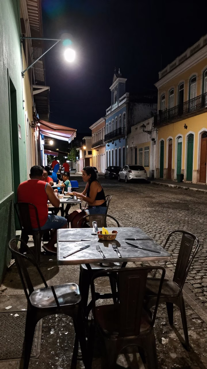 Late Night Street Scene in Salvador Brazil with Cutlery on Table in in Salvador, Brazil