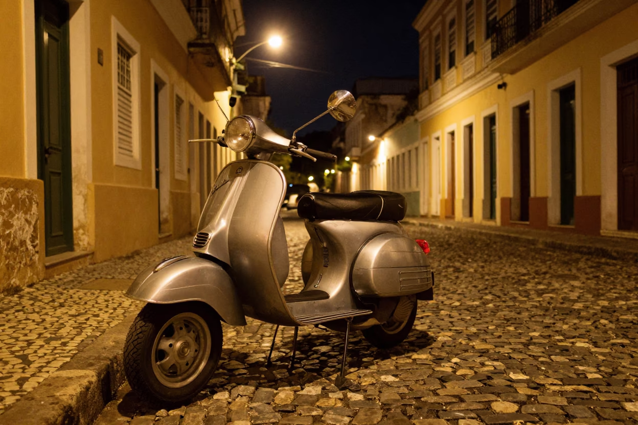 Late Night Street Scene in Salvador Brazil with Vintage Vespa on Cobblestone Lane in in Salvador, Brazil