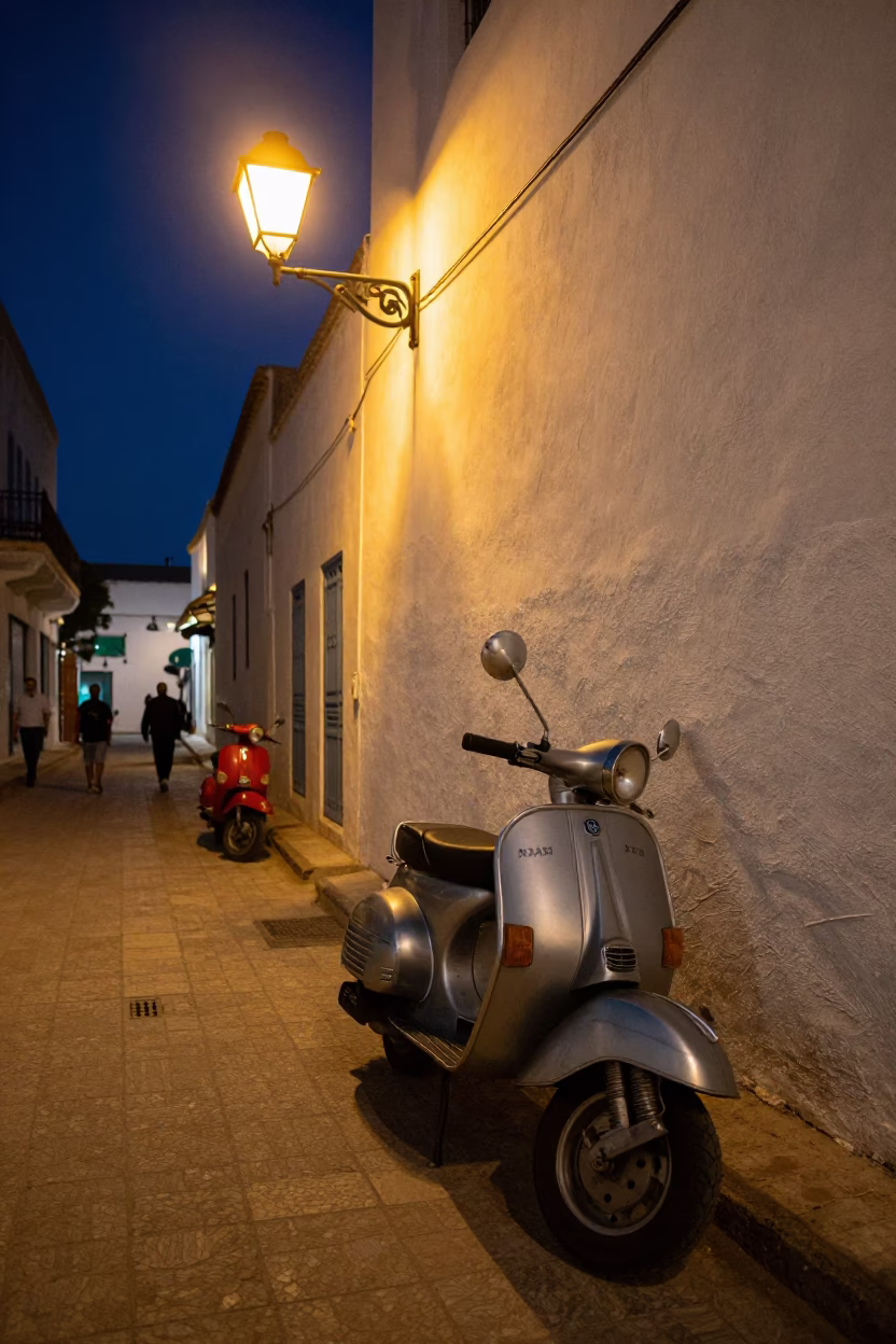 Late Night Tunis Street Scene with Scooter and Warm Streetlight Illumination in in Tunis, Tunisia