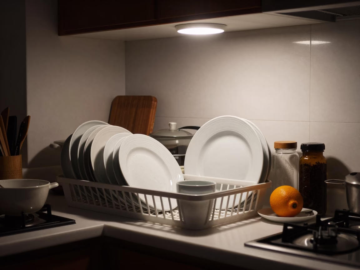 Late Night Valencia Kitchen Scene with Dish Rack and Water Rings on Tile Grout in in Valencia, Spain