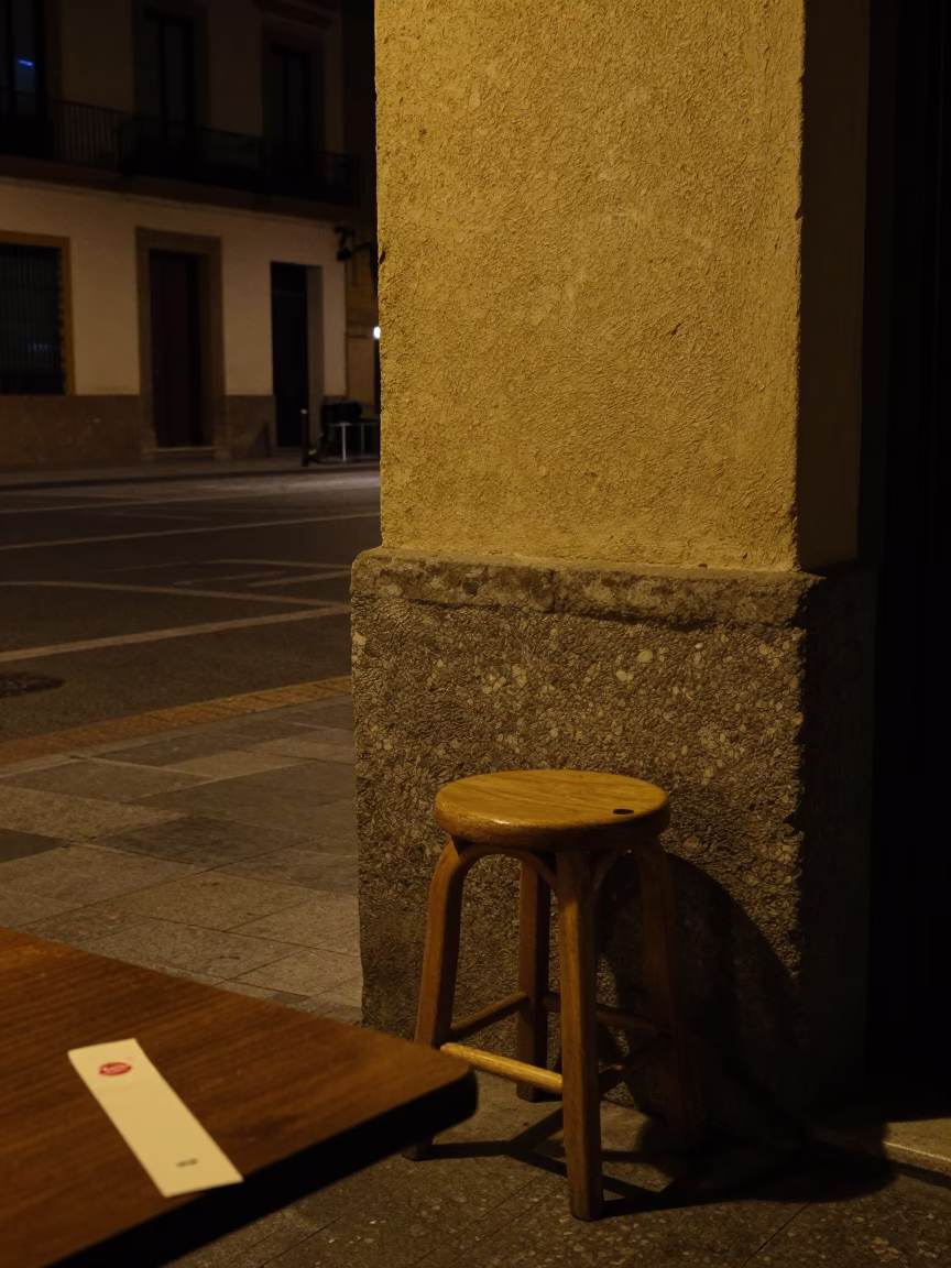 Late Night Valencia Street Scene with Stool and Bookmark on Table in in Valencia, Spain