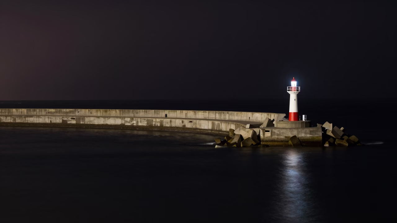 Late Night Valparaiso Harbor Breakwater and Lonely Beacon Under Deep Night Sky in in Valparaiso, Chile