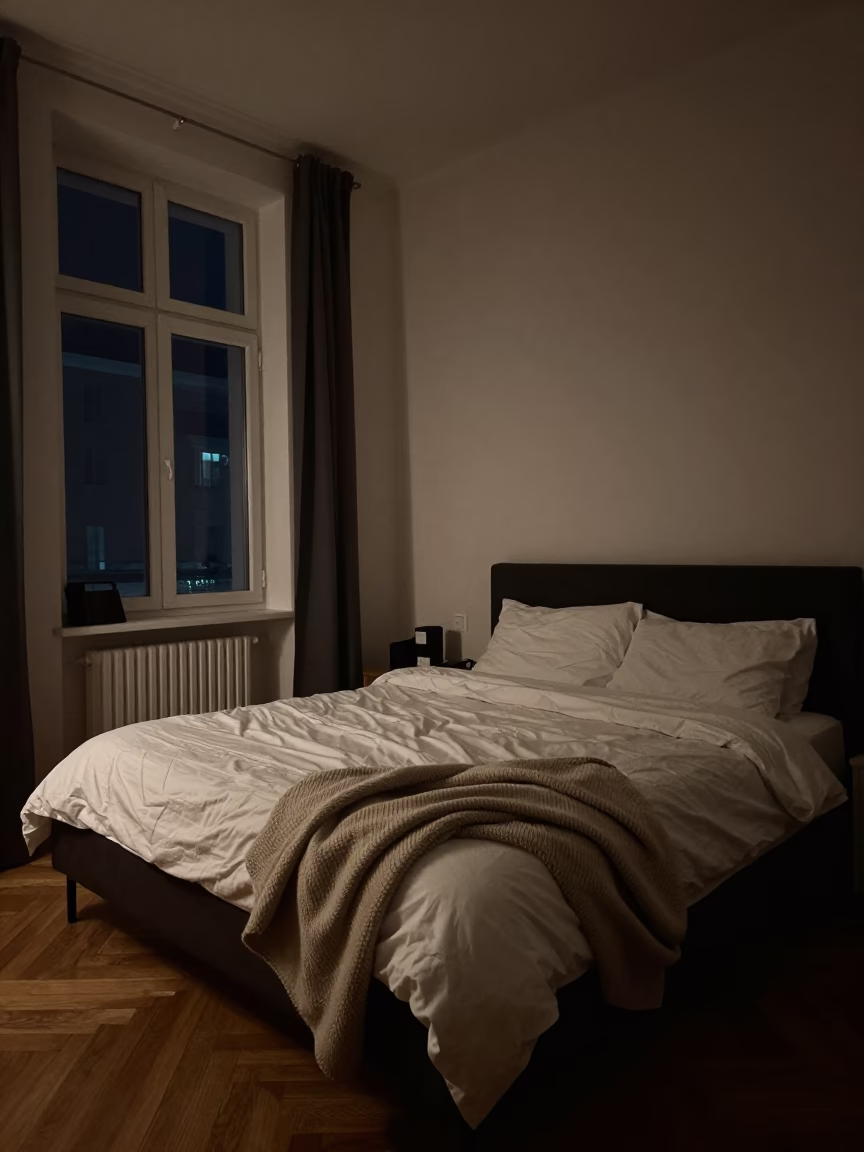 Late Night Vienna Apartment Interior with Bed and Cozy Blanket in Deep Night in in Vienna, Austria