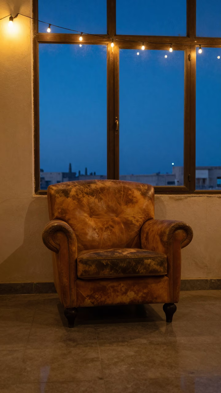 Leather Rocking Chair Winter Twilight Port Said in on a worn leather armchair in Port Said