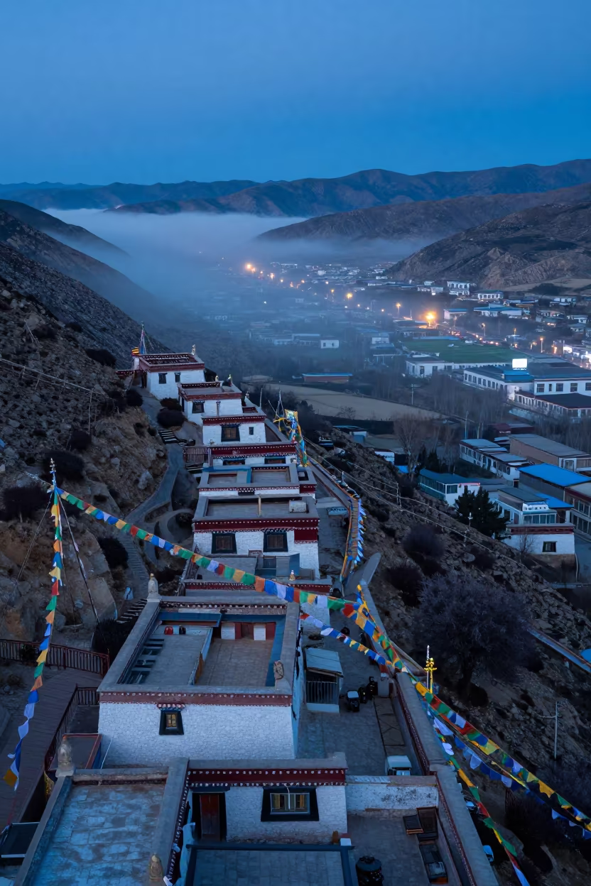 Lhasa Rooftops Above Valley Fog at Blue Hour in along a high mountain pass beneath prayer flags near Lhasa