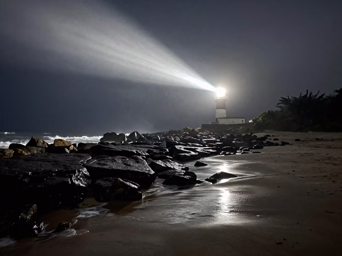 Lighthouse Beam Sweeping Rocky Colombian Shore in along a wave-cut shoreline in Colombia
