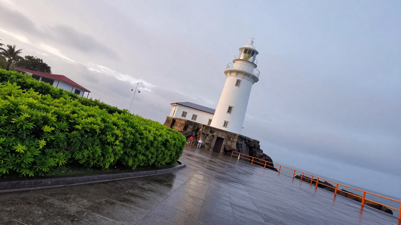 Lighthouse on Plaza Stack After Rain in across a formal civic plaza in Nampula