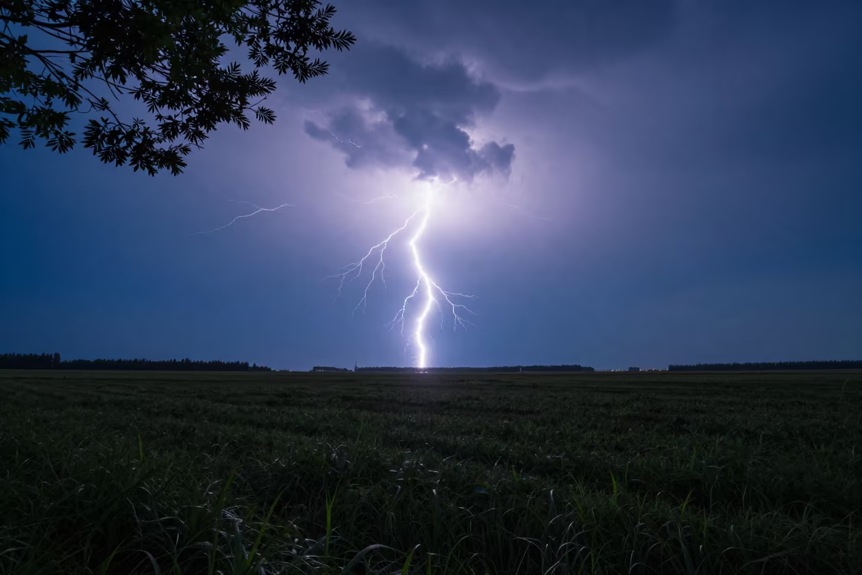 Lightning Forks Over Dark Prairie Under Clear Sky in beneath fast-moving cloud bands near Wuhan