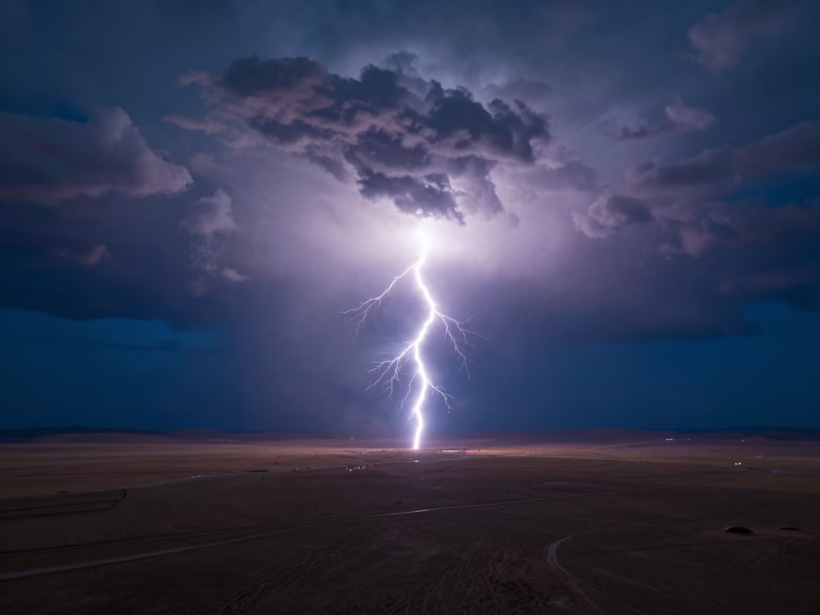 Lightning Strike Over Mongolian Thunderheads Night in over a horizon of stacked thunderheads in Mongolia