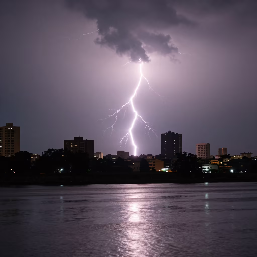 Lightning Striking Thunderhead Over Abidjan City in across a storm-bright plain near Abidjan